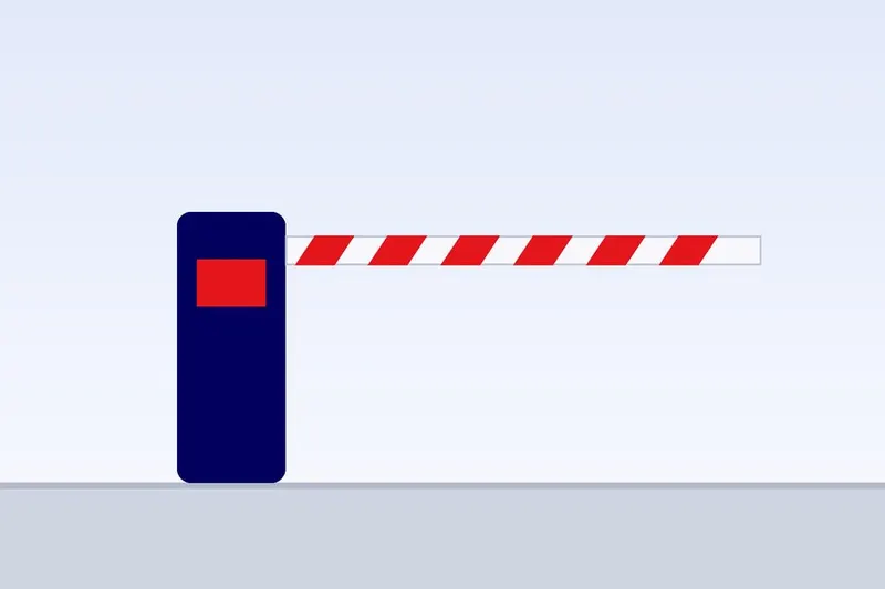 Compact access barrier beside a car park entrance with a card reader post